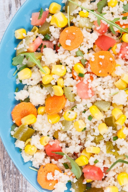 Salad with vegetables and couscous groats Light meal containing vitamins and minerals