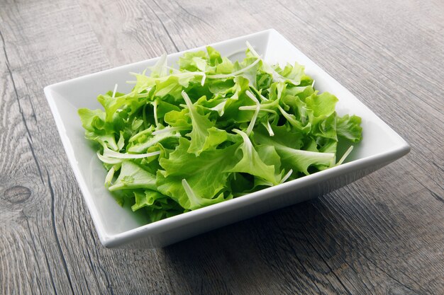 Salad on wooden table