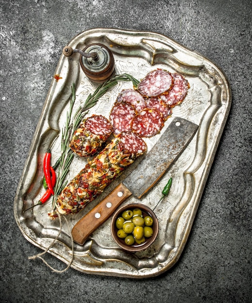 Salalmi on a steel tray on a rustic background