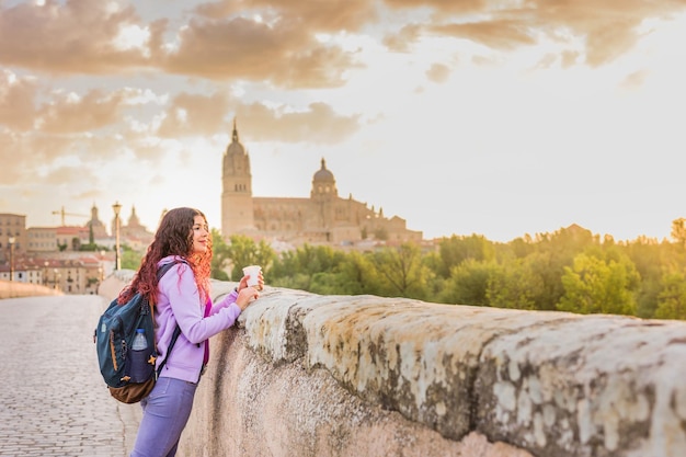 Salamanca spain castile and leon unesco tourism cathedral sunset with female young latin tourist