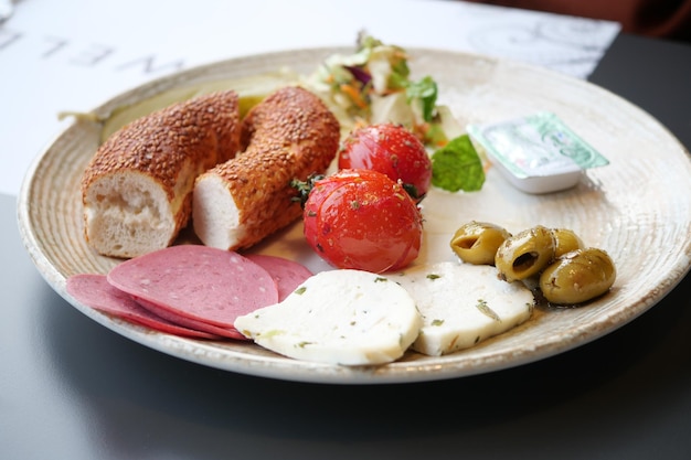 Salami sausage olive and bread on a plate