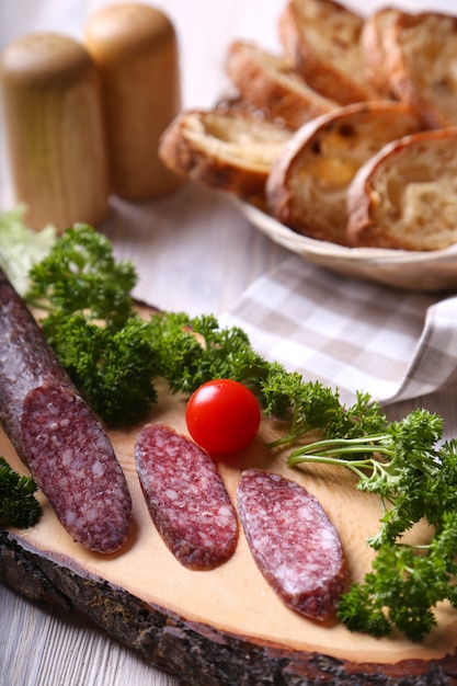 Salami sausages on a wooden board