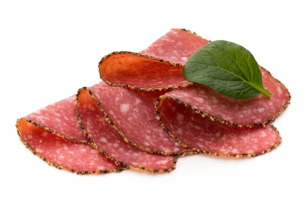 Salami slices against white surface