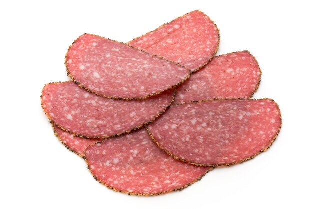 Salami slices isolated on the white background.