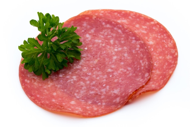 Salami smoked sausage slices isolated on white background cutout.