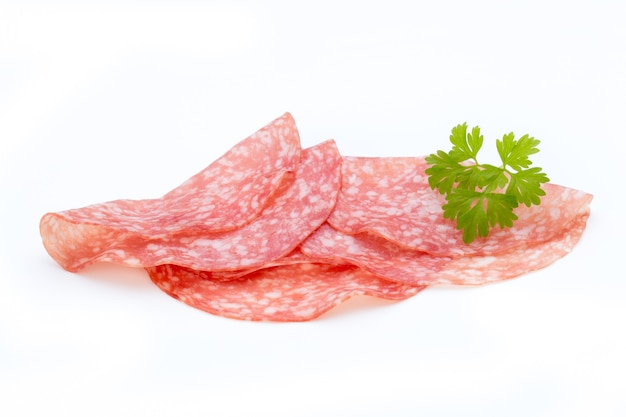 Salami smoked sausage slices isolated on white background cutout.