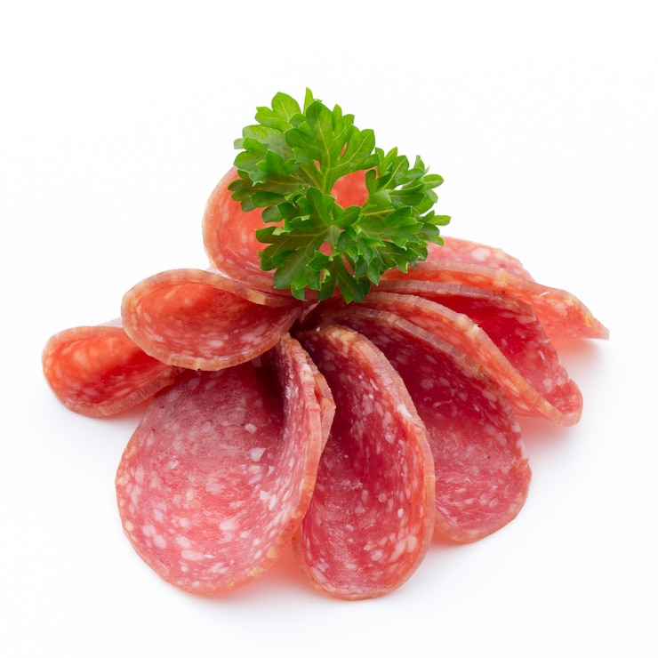Photo salami smoked sausages slices isolated on white background.
