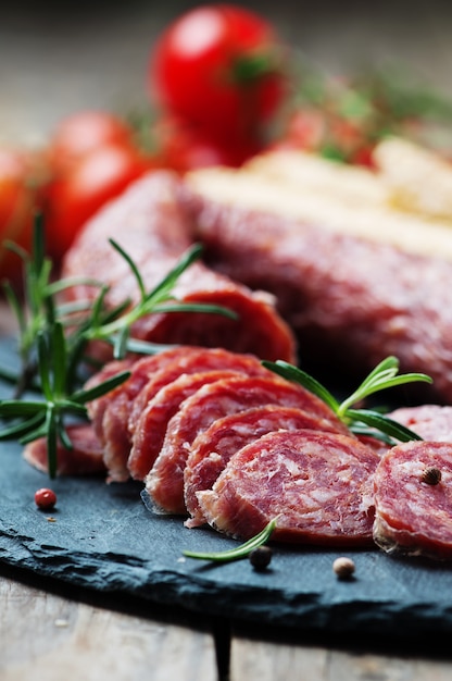 Salami on the wooden table