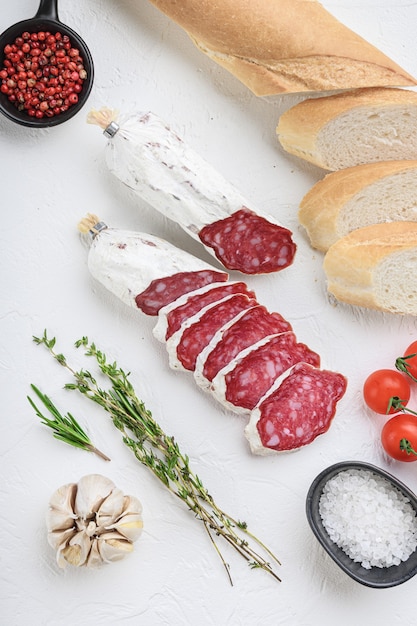 Salcichon slices with panini and herbs isolated