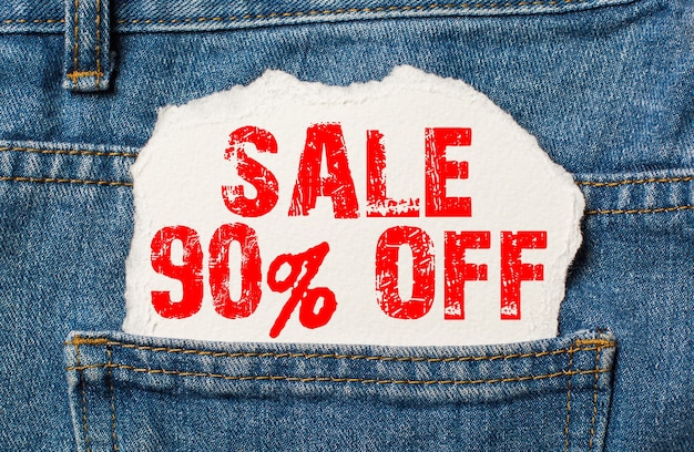 Sale 80% off on white paper in the pocket of blue denim jeans