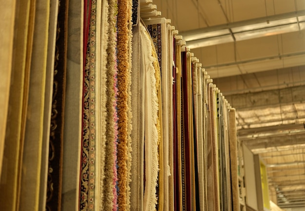 Sale Assortment of different carpets in store close up pictrure