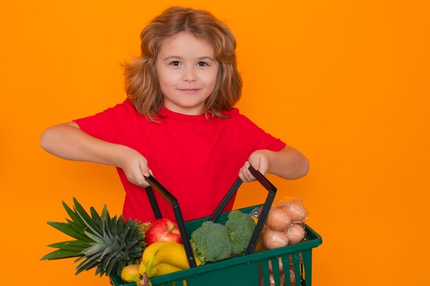 Sale and discount child grocery cart isolated studio yellow background with copy space little