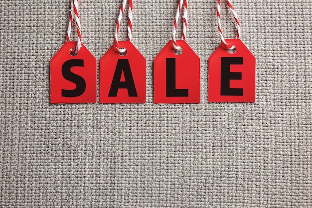 Sale labels on fabric background