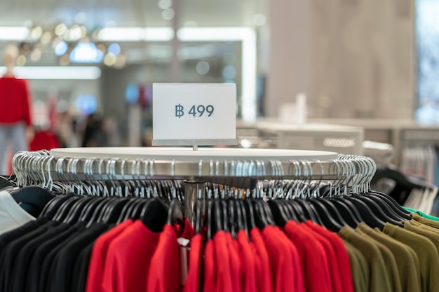 Sale off mock up advertise display frame setting over the clothes line in the shopping store