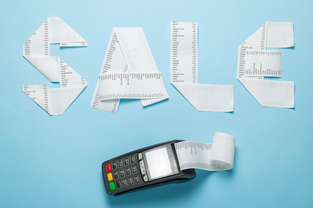 Sale of paper bill and pic terminal for payment on a blue background.