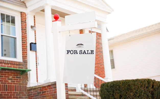 A for sale sign outside a home