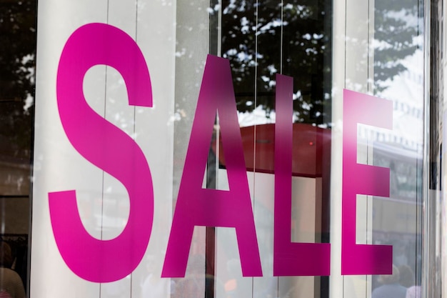 Photo sale sign in a retail shop window shopping discount