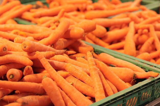 Sale of washed carrots in plastic boxes sale of carrots selective focus vegetables in a supermarket