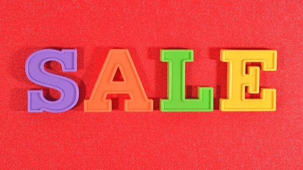 Sale written by colorful letters on a red