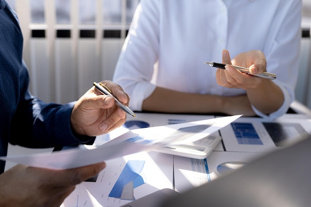 The sales department is having a monthly summary meeting to bring it to the department manager, they are verifying the correctness of the documents that are prepared before bringing in to the manager