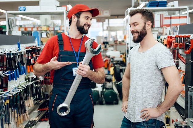 Salesman is Showing New Giant Wrench to Client