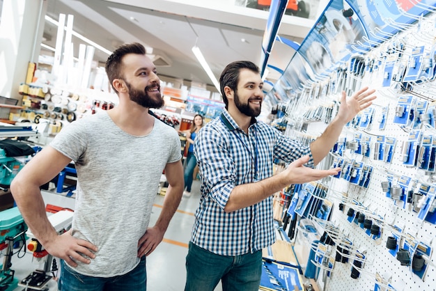 Salesman is Shows Selection of Equipment to Client