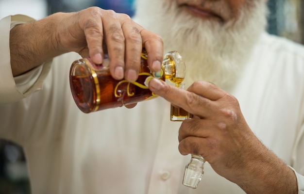 The salesman in a traditional perfume store