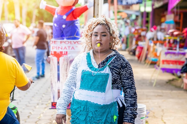 Saleswoman Attracting Customers to Her Stall with a Whistle in Vibrant Market Scene in Latin America