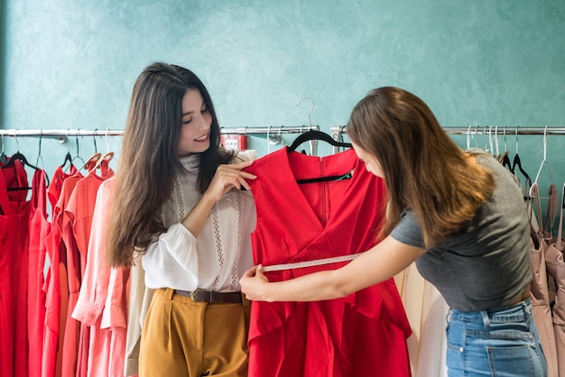 Saleswoman work with customer in fashion store. Concept fashion design.  Black friday