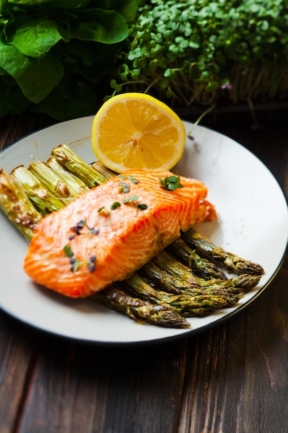 Salmon and asparagus with lemon and micro green, healthy food and lifestyle