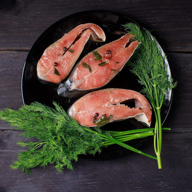 Salmon and beer on wooden background