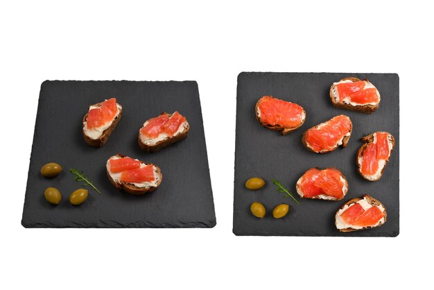 Salmon on a bread with cream isolated on white