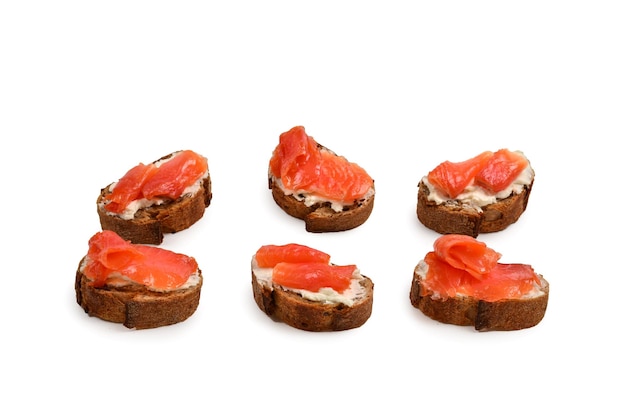 Salmon on a bread with cream isolated on white