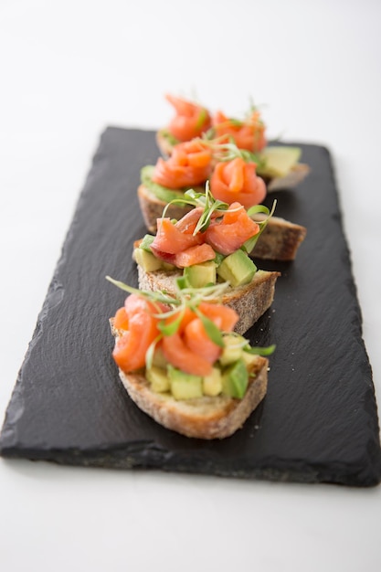 Salmon bruschetta entree appetizer on bread