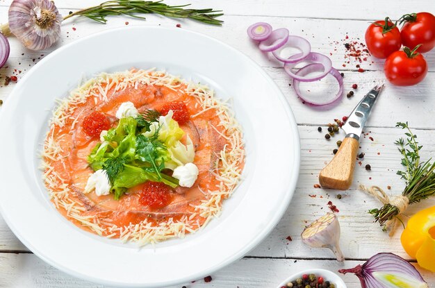 Salmon carpaccio with red caviar Top view Free space for your text
