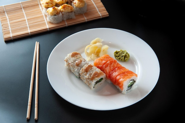 Salmon and caviar rolls served on a plate