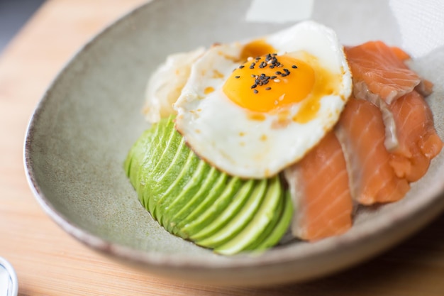 Salmon Donburi with egg on the top. Japanese lunch box.