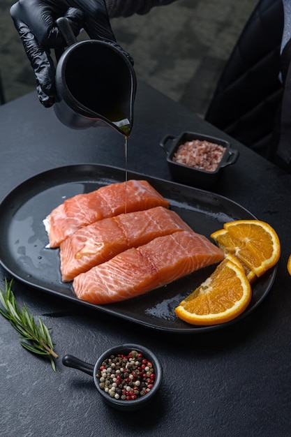 salmon fillets on a black plate