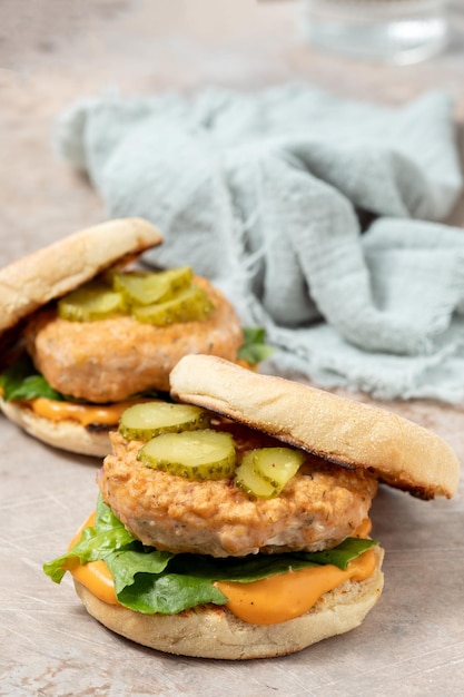 Salmon fishburger english muffin sandwich