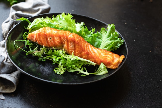 Salmon fresh salad leaf fish grill seafood fried grilled snack meal on the table copy space food