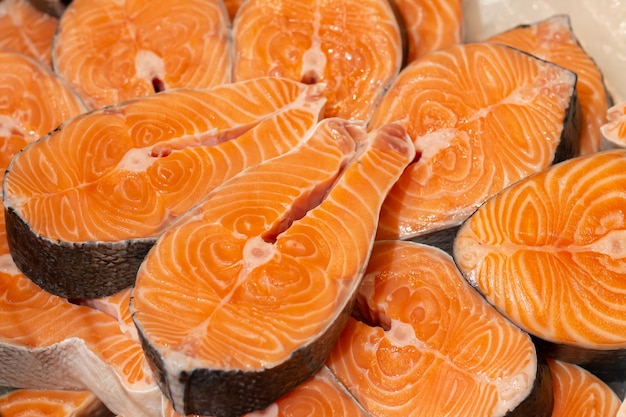 Salmon fresh steaks slices of raw red fish ready ro cooking