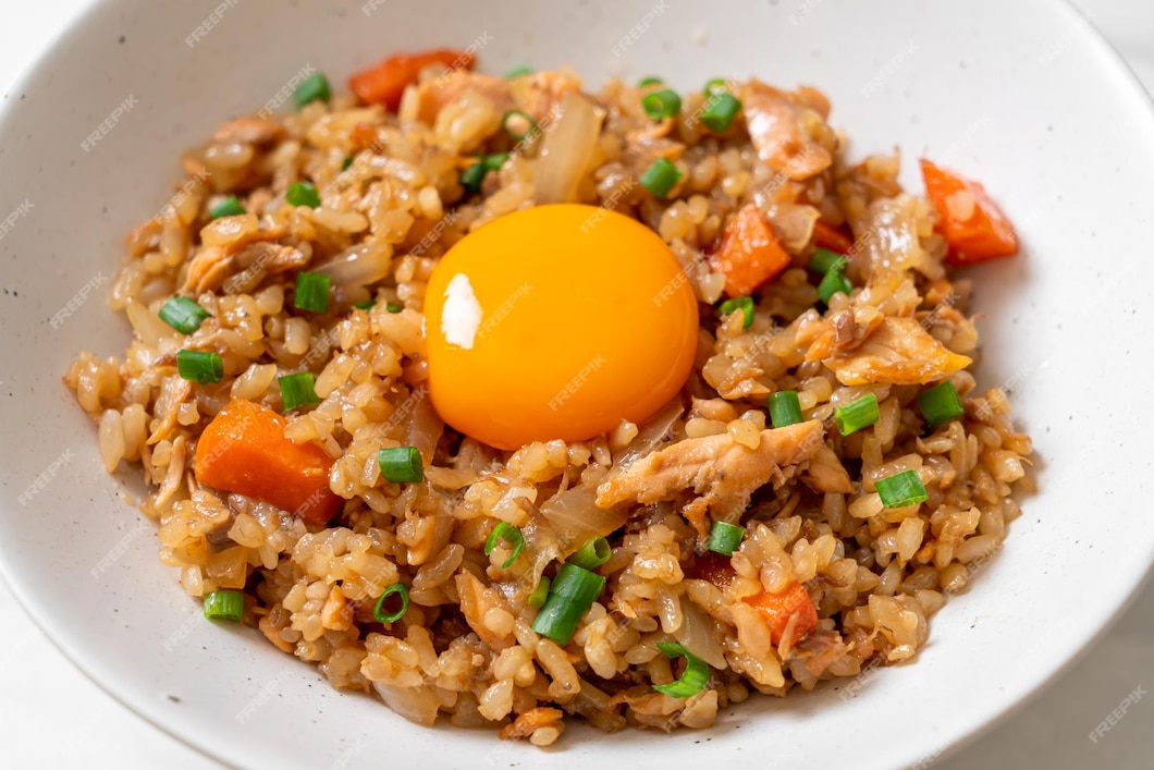 Premium Photo | Salmon fried rice with pickled egg on top - asian food ...