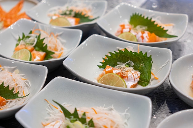 Salmon is placed in a white dish.