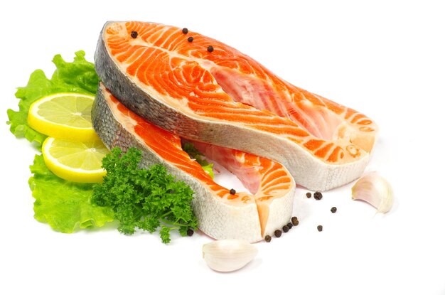 Salmon and lettuce isolated on white background