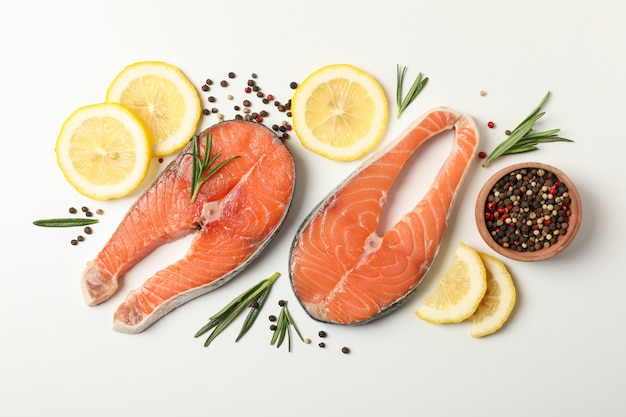 salmon meat and spices on white background