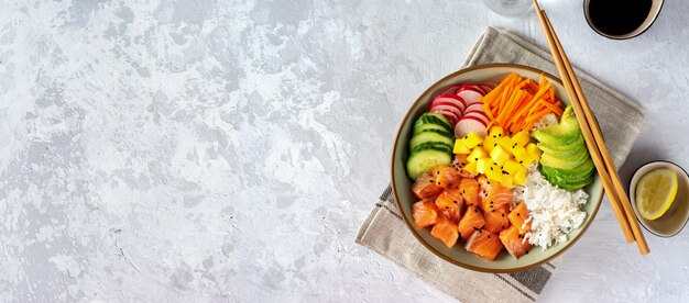 Salmon poke with avocado, seaweed, pickled carrots and cucumber