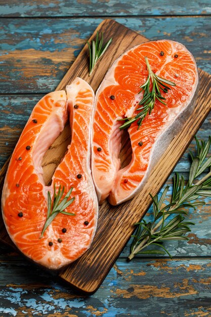 Salmon. Raw trout red fish steak with ingredients for cooking.