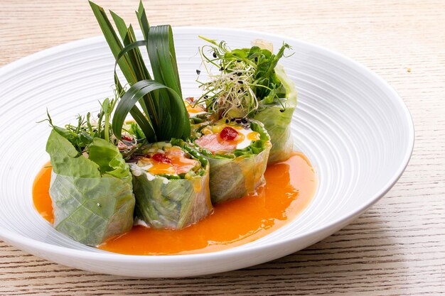 Salmon roll with philadelphia cheese and pickled pumpkin in
rice paper with daikon and ponzu sauce panasian dish