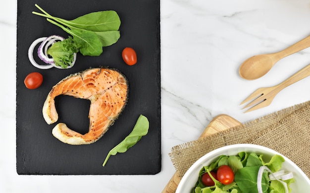 Salmon salad grill on plate.