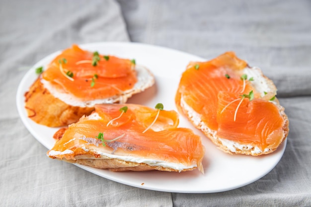 Salmon sandwich smorrebrod fish open sandwich seafood fresh meal food diet snack on the table